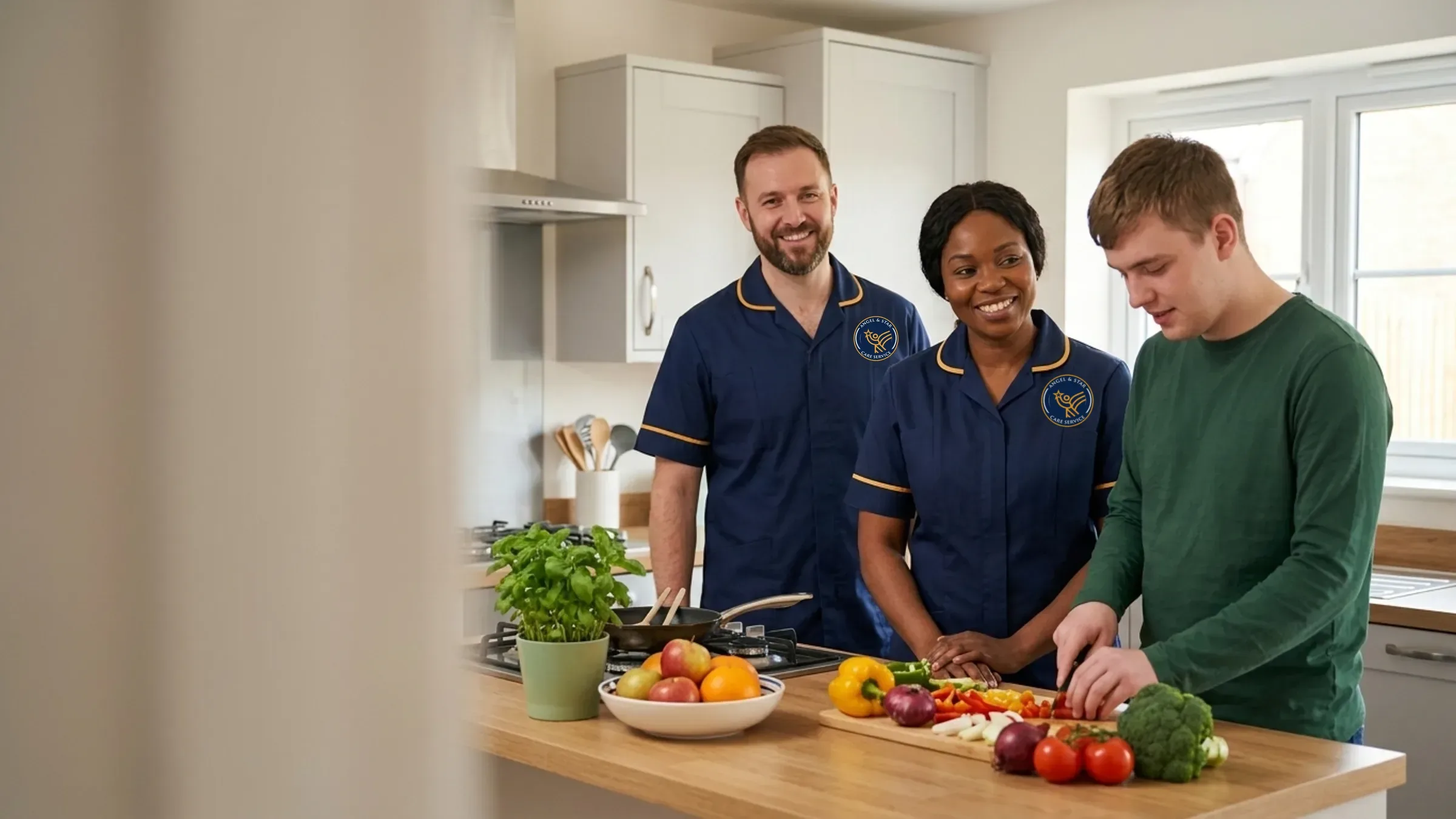 Angel & Star support worker helping a young man prepare a healthy lunch in a bright supported living kitchen in Nuneaton